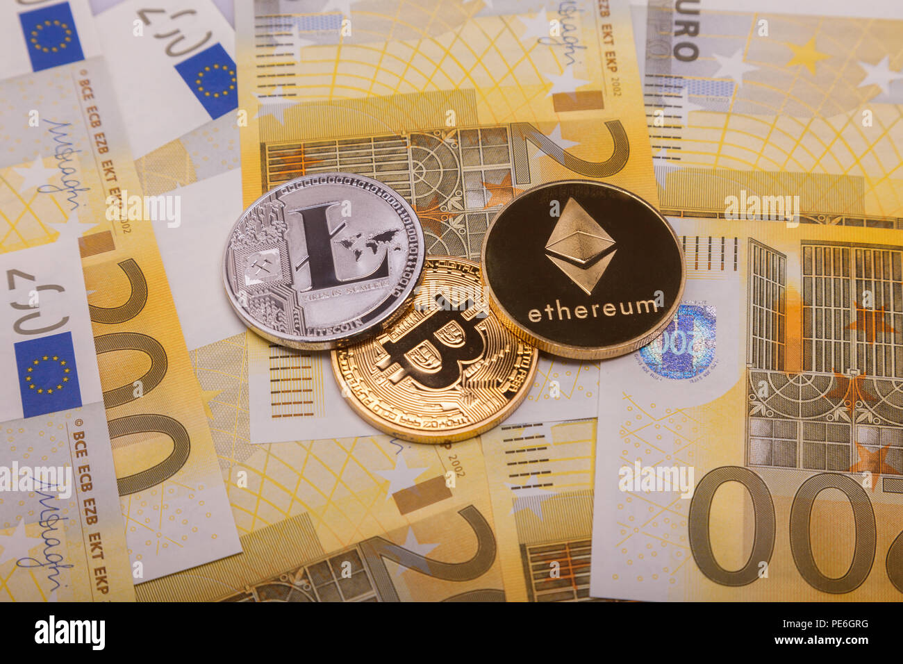 Bitcoin btc crypto currency coin over 200 euro bank notes Stock Photo -  Alamy