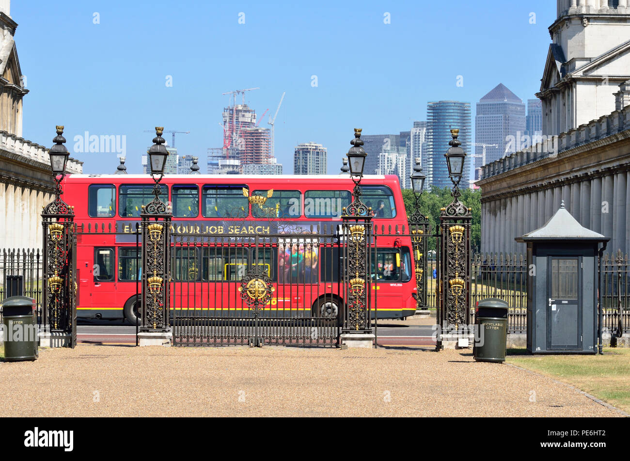 Red Double Decker bus passing the gate to Queen's House, Greenwich, England 180627 73623 Stock Photo