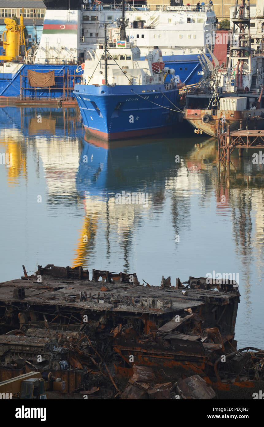 Rusty remains of a scrapped vessel at Bibiheybat shipyard in metropolitan Baku (Azerbaijan), Caspian Sea Stock Photo