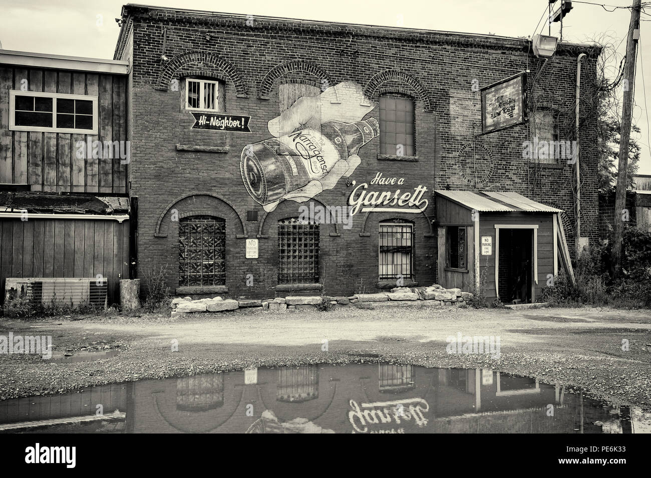 An old building in Worcester, MA with a 'ghost image' of an old Narragansett Beer sign painted on the buildng - just behind Ralph's Diner on Grove St. Stock Photo