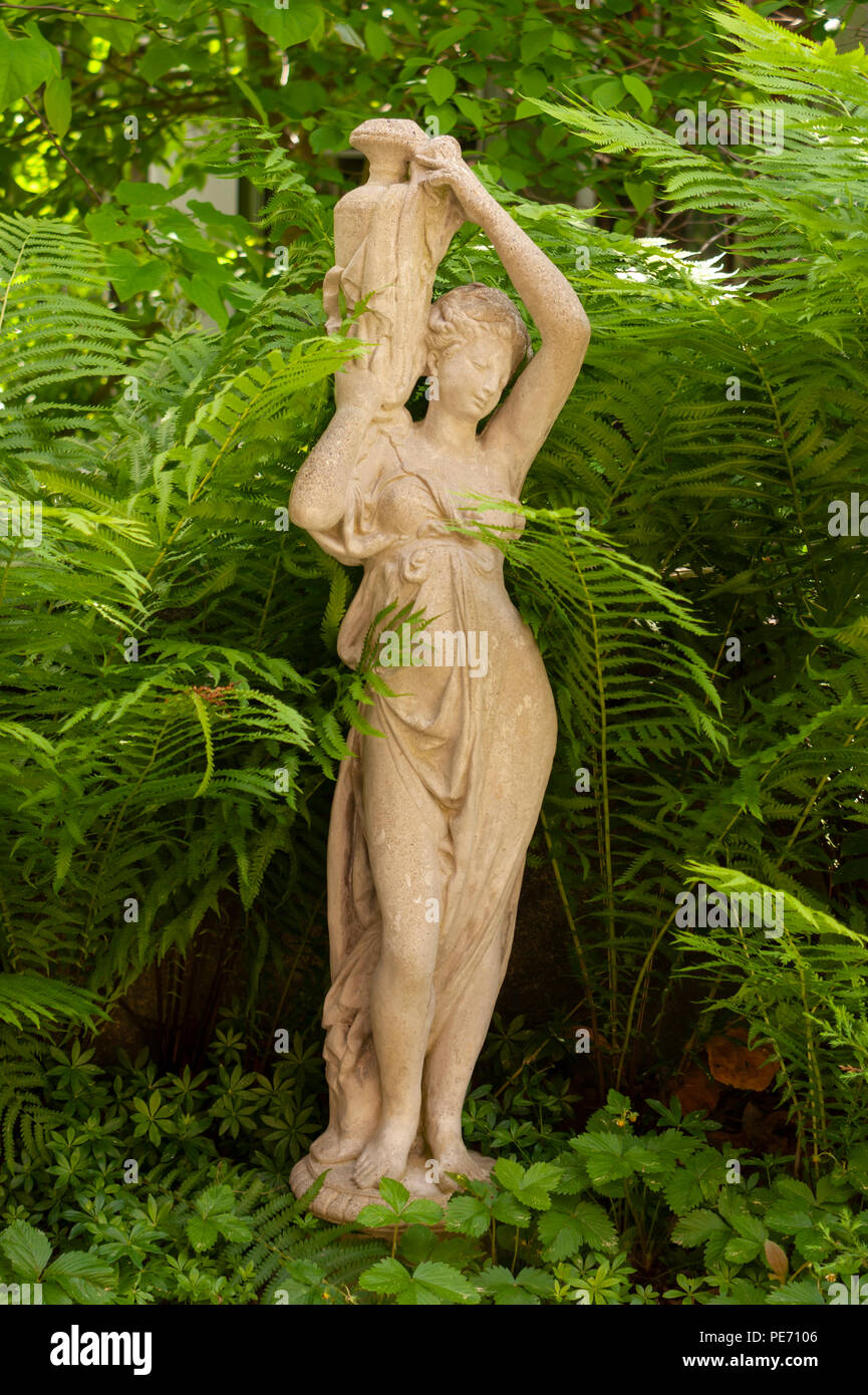 Dione the divine water goddess, carrying her jar. Stone statue in a