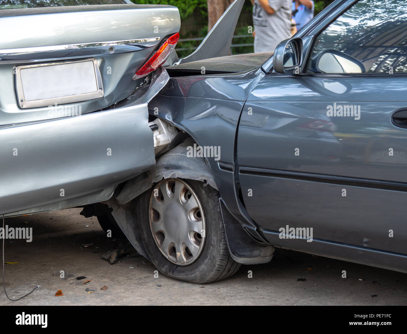 Car crash accident on street with wreck and damaged automobiles. Accident caused by negligence
