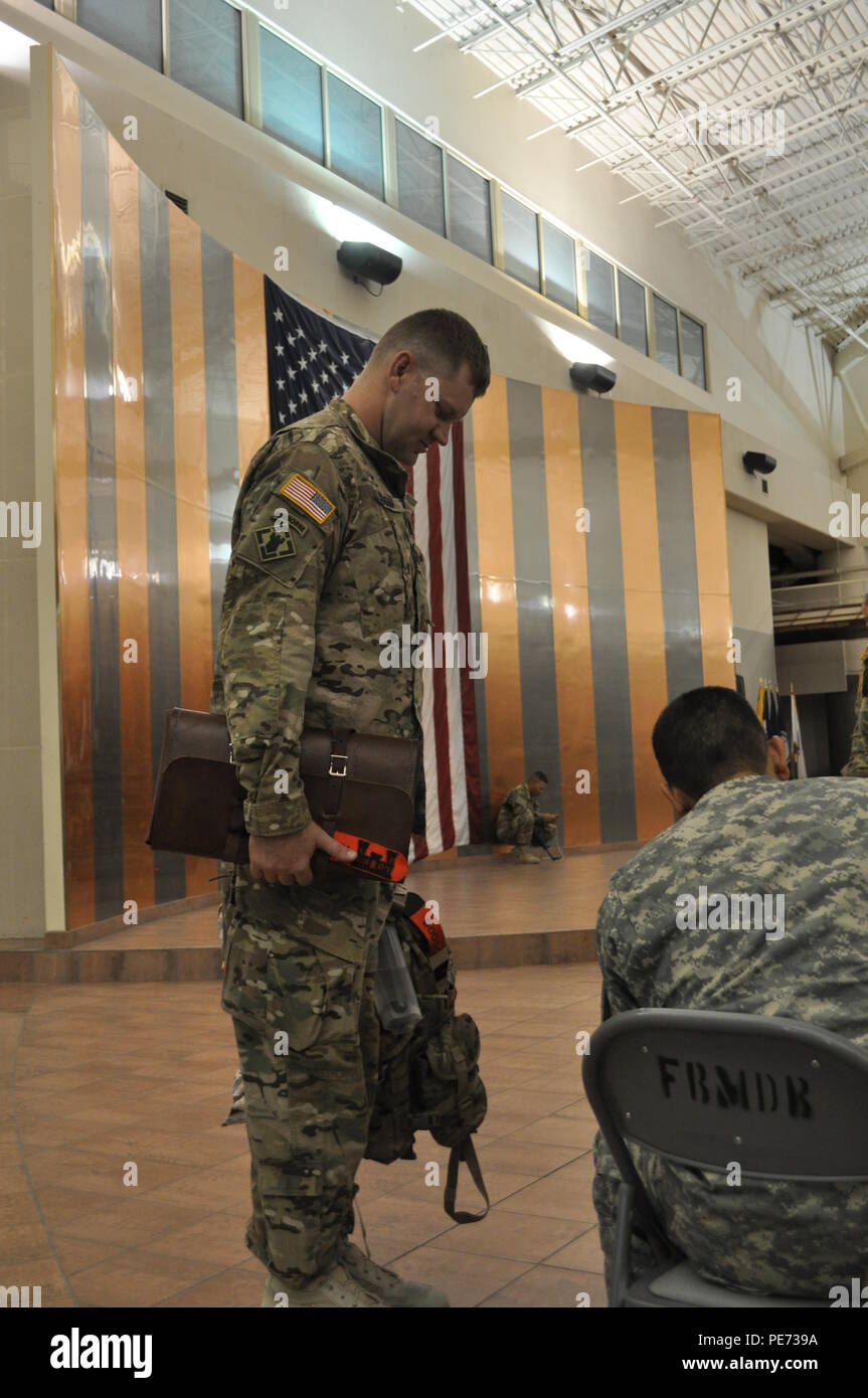 Capt. David Dodson, commander, 155th Eng. Co., weighs in while an airfield operator records the measurement for the flight manifest, Oct. 1, at the Silas L. Silas L. Copeland Arrival/Departure Control Group prior to the unit’s departure to the Middle East. Stock Photo