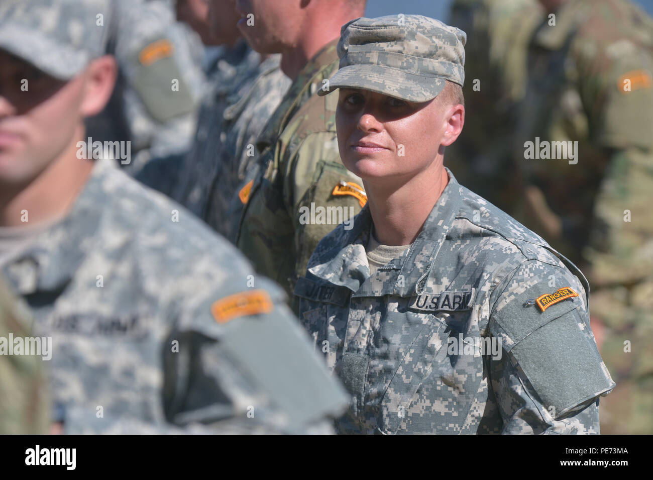 U.S. Army Maj. Lisa Jaster stands in formation during the Ranger School graduation on Fort Benning, Ga., Oct. 16, 2015. Jaster is the third female Ranger School graduate. (U.S. Army photo by Staff Sgt. Alex Manne/ Released) Stock Photo
