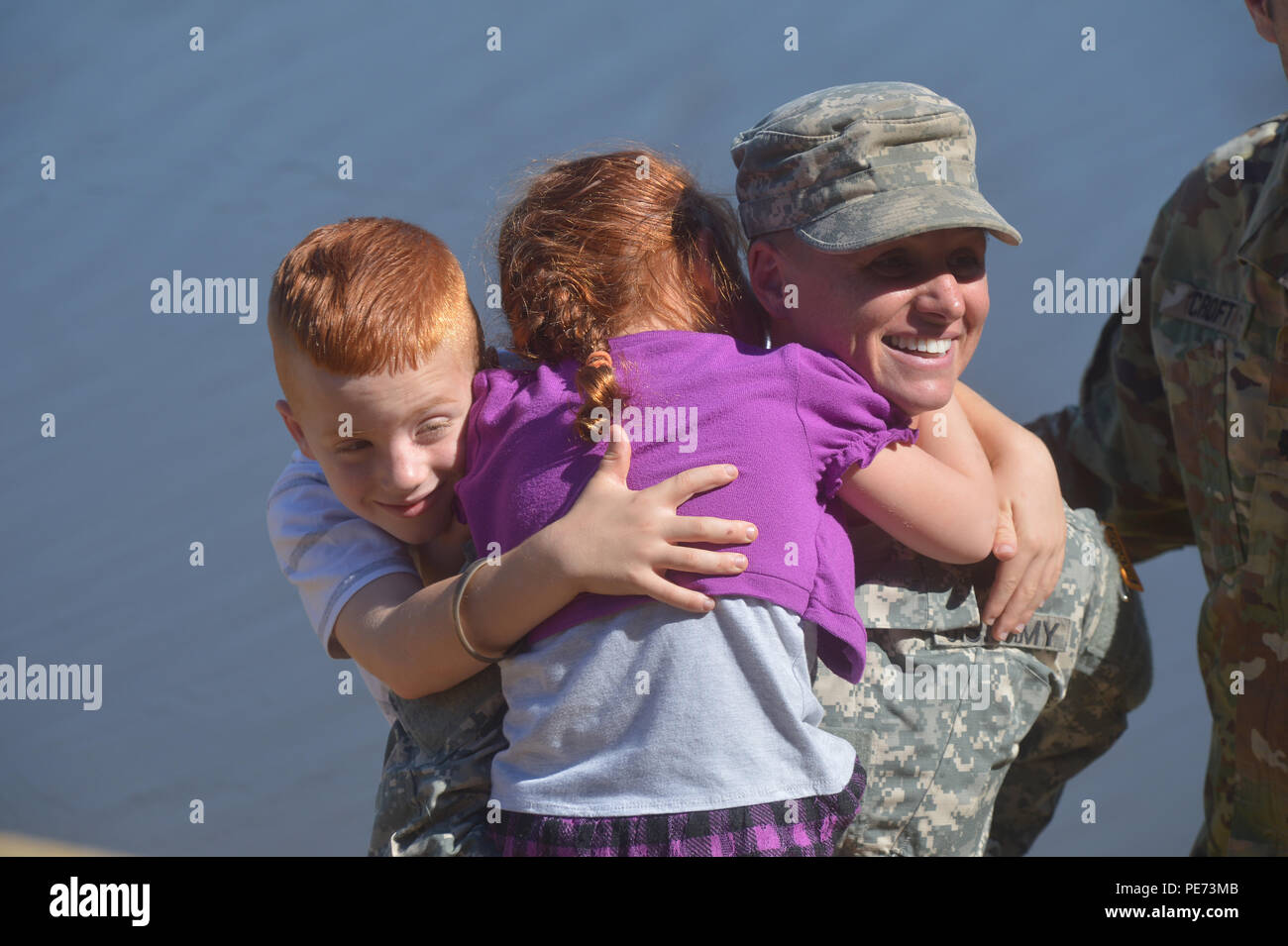 U.S. Army Maj. Lisa Jaster is congratulated by her children following graduation from Ranger School on Fort Benning, Ga., Oct. 16, 2015. Jaster is the third female to graduate Ranger School. (U.S. Army photo by Staff Sgt. Alex Manne/ Released) Stock Photo