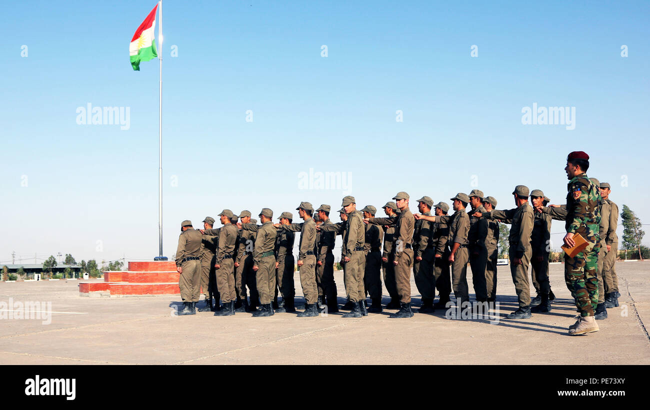 Peshmerga soldiers assemble before marching to training near Erbil ...
