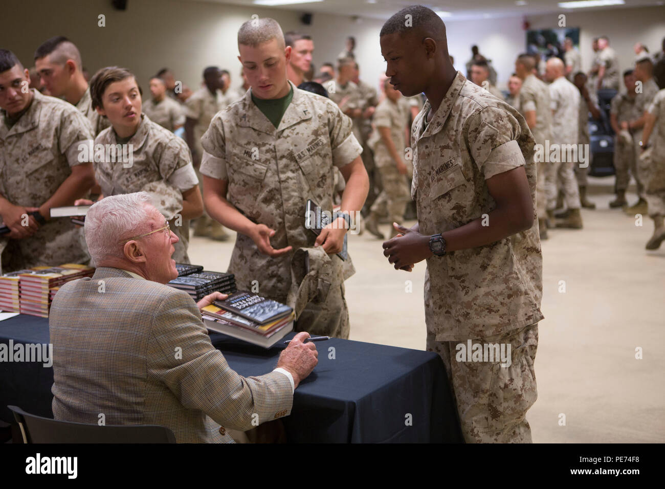 Medal of Honor Recipient Marine Col. Wesley L. Fox (retired), speaks with Marines from Fox Company, Marine Combat Training Battalion, School of Infantry-East, during a scheduled visit with the Marine Corps Association on Camp Geiger, Oct. 19, 2015. Col. Fox is a retired Marine of 43 years who served in the Korean War and was awarded the Medal of Honor for his actions in the Vietnam Conflict. (Marine Corps photo by SOI-East Combat Camera, Cpl. Andrew Kuppers/Released) Stock Photo