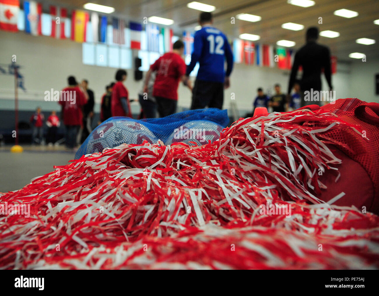 Soccer equipment and pompoms lie on the floor during the Kaiserslautern Military Community Adaptive Sports soccer event Oct. 15, 2015, at Vogelweh Military Complex, Germany. Students from Ramstein and Vogelweh Middle and High Schools came together for a friendly soccer competition to build camaraderie and morale. (U.S. Air Force photo/Airman 1st Class Larissa Greatwood) Stock Photo