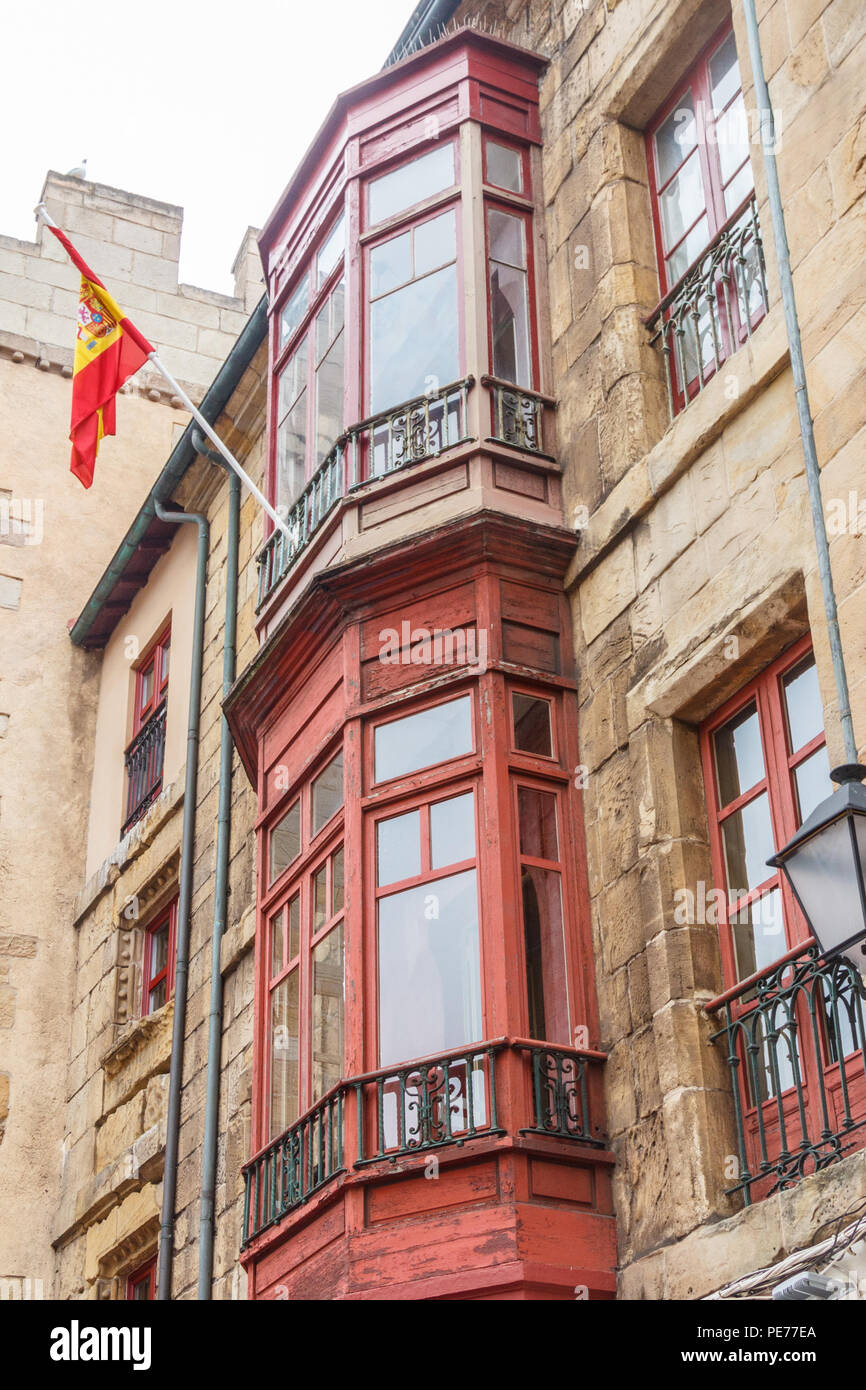 Typical enclosed balconies on houses in Gijon, Spain Stock Photo
