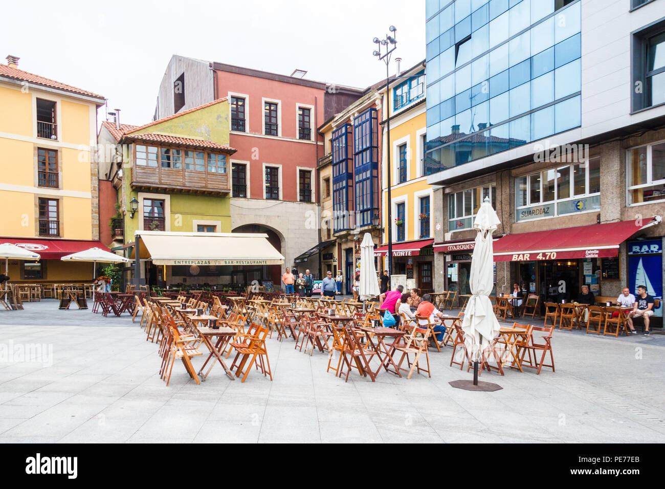 Gijon, Spain - 6th July 2018: Typical square with bars. Al fresco eating and drinking is popular all over Spain. Stock Photo