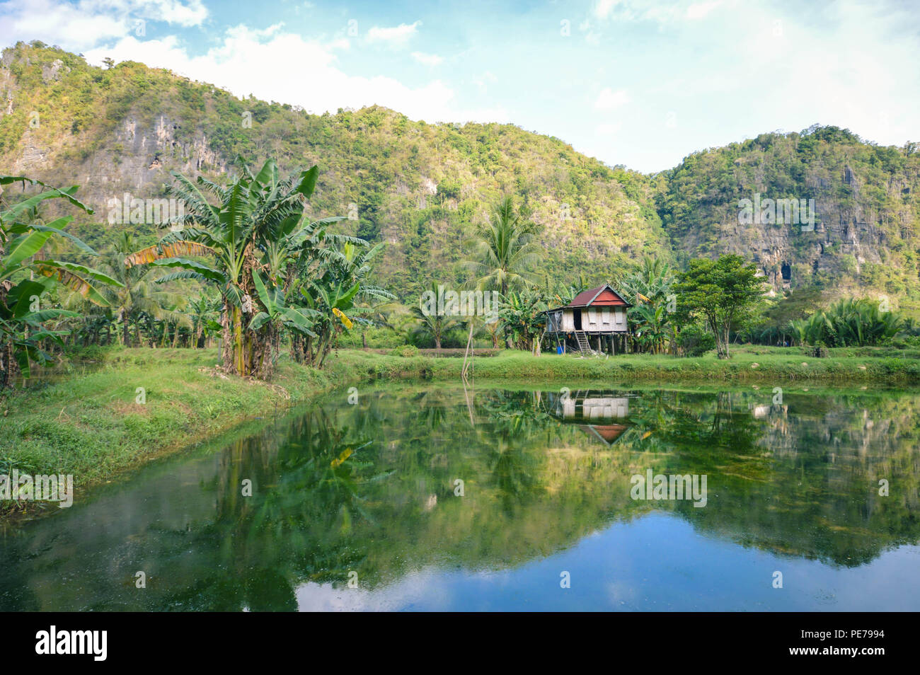 Beautiful limestones and water reflections in Rammang Rammang park near Makassar, South Sulawesi, Indonesia Stock Photo
