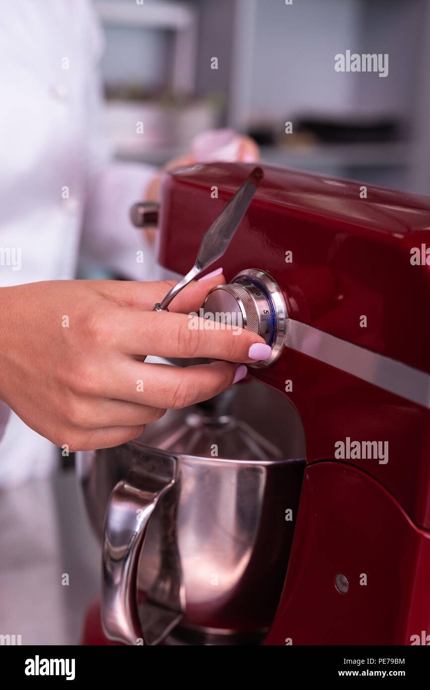Professional baker using modern kitchen equipment Stock Photo Alamy