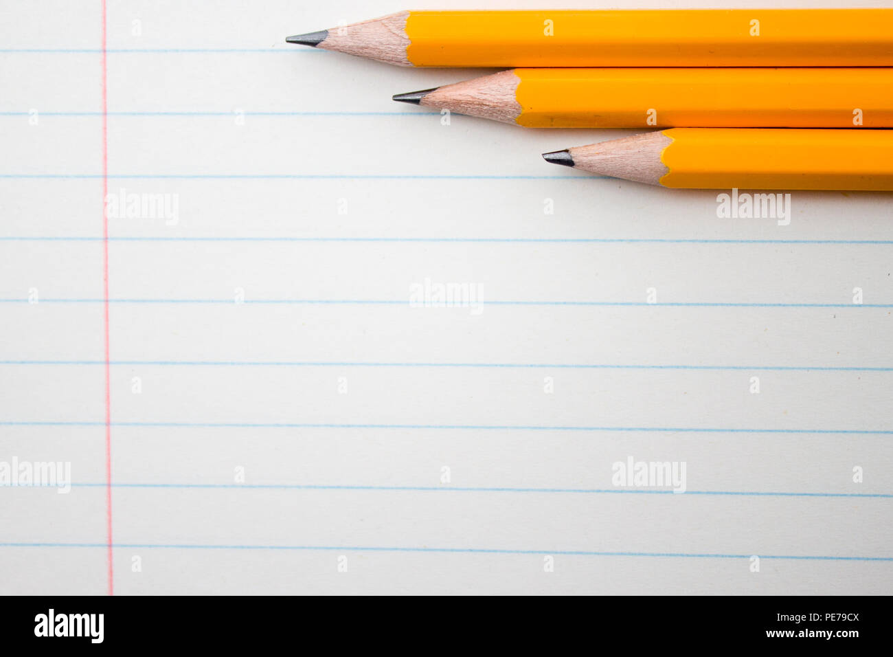 Back to school, education concept - orange pencils close up and composition book on background for educational new academic year begin or study term Stock Photo