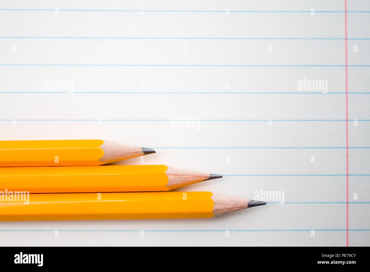 Back to school, education concept - orange pencils close up and composition book on background for educational new academic year begin or study term Stock Photo