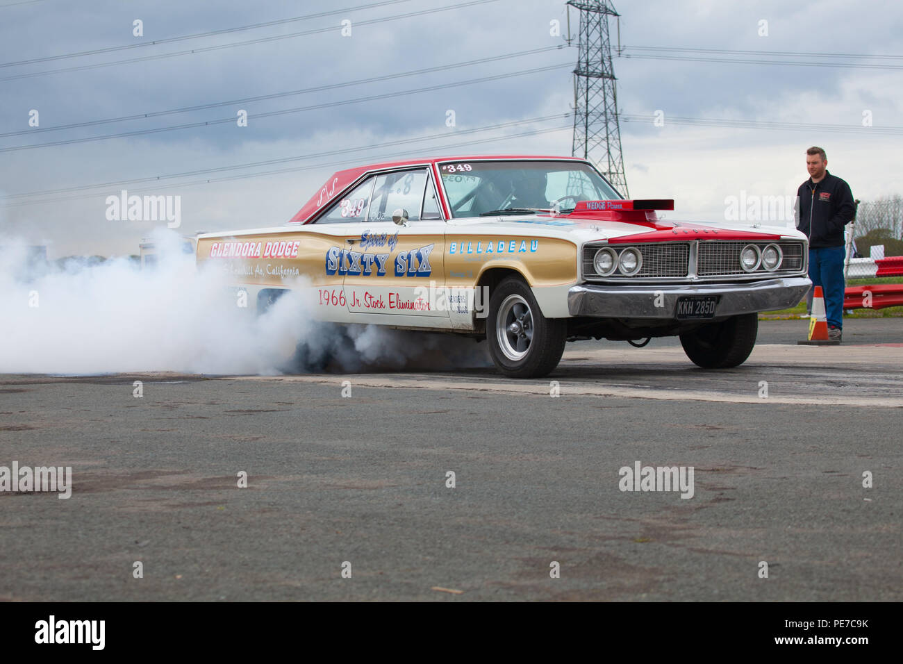 A car performing a wheel spin to warm up the tyres before racing on the drag strip of York Raceway in Melbourne,East Yorkshire Stock Photo