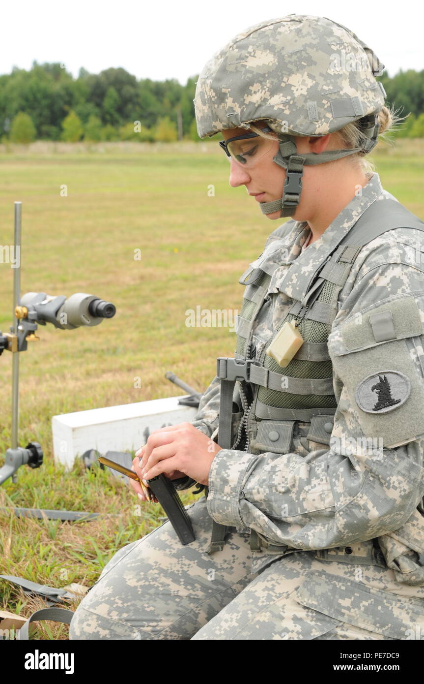 Staff Sgt. Nicole Williams loads her magazines before her turn to fire rounds during the