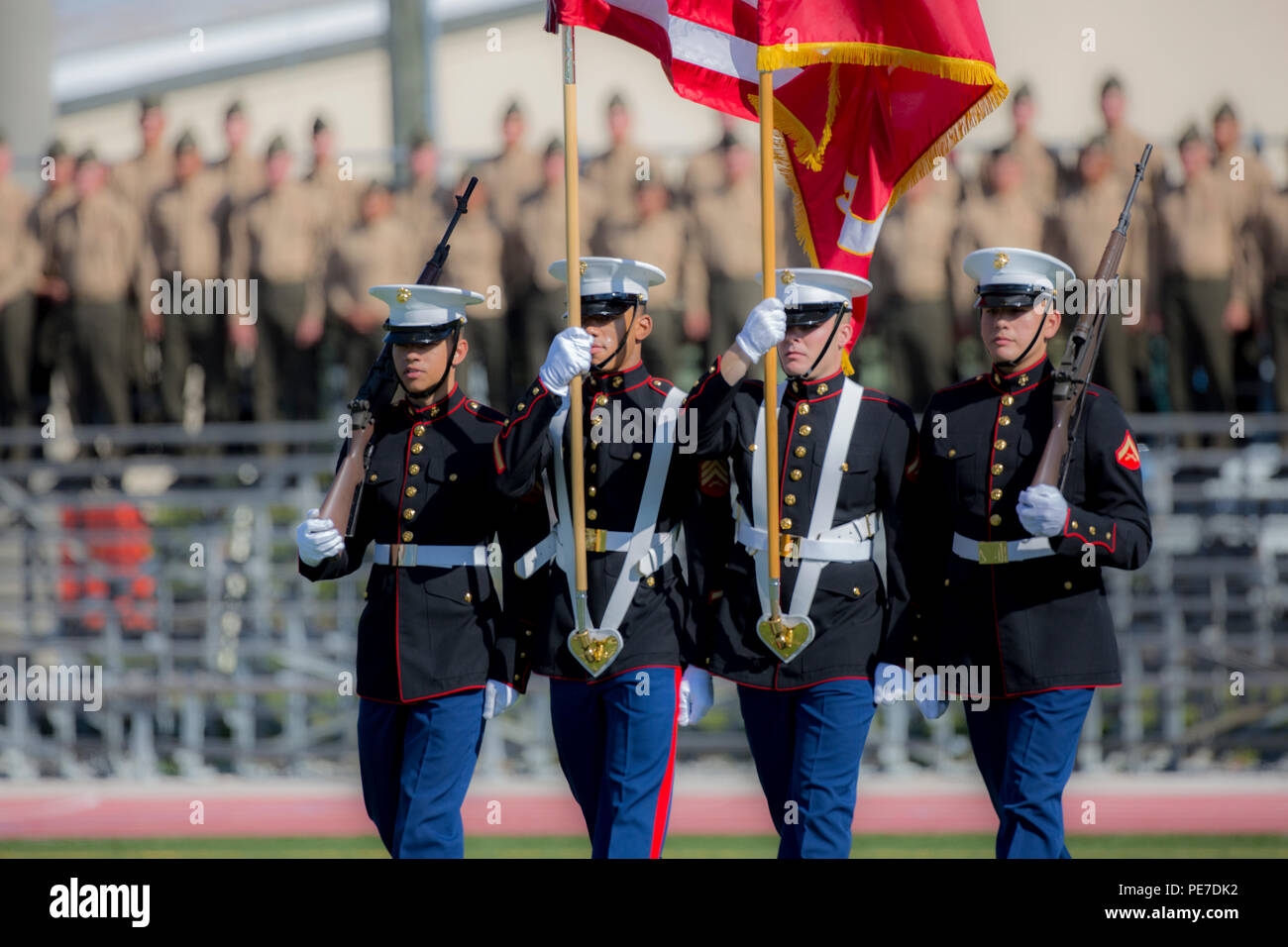 U.S. Marines with the Marine Corps Installations East color guard walk