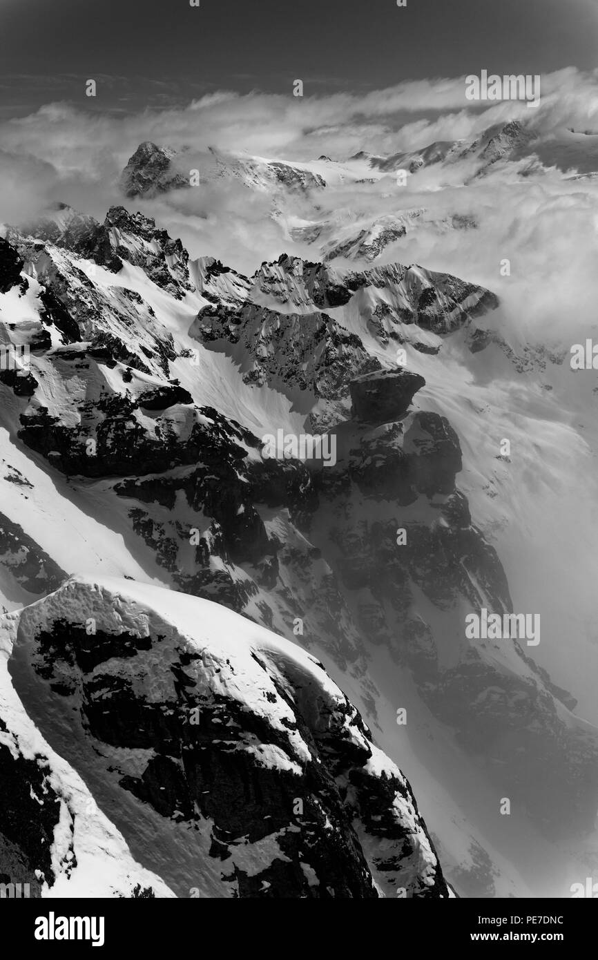 View at the mount Titlis peak in foggy misty weather in black and white