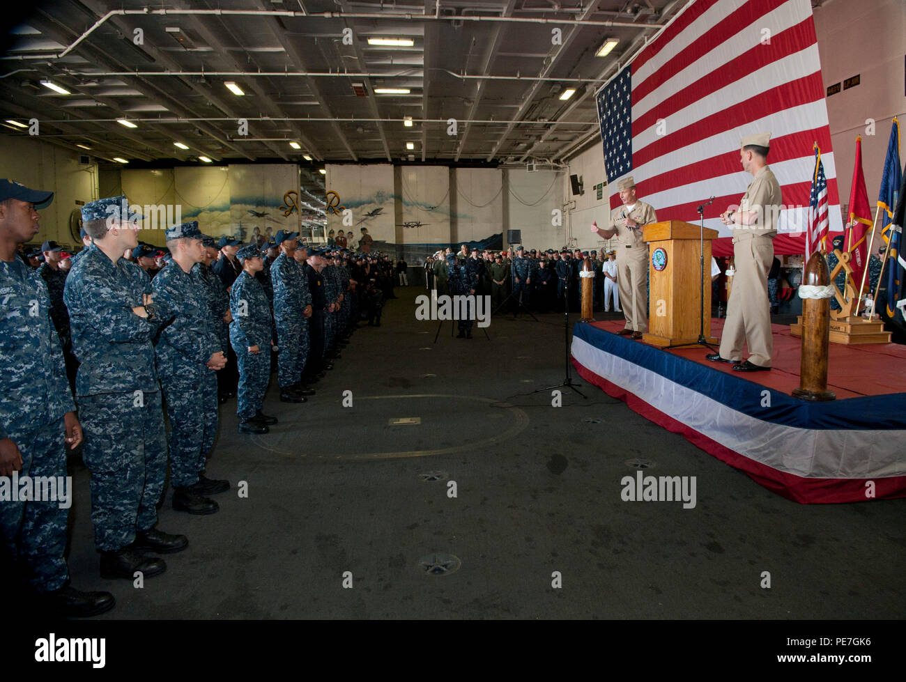 151015-N-OT964-235 YOKOSUKA (Oct. 15, 2015) Master Chief Petty Officer of the Navy (MCPON) Mike Stevens and Chief of Naval Operations (CNO) Adm. John Richardson answer Sailors questions during an all hands call aboard the aircraft carrier USS Ronald Reagan (CVN 76). Stevens and Richardson are in Japan as part of their round-the-world tour, visiting Sailors in Hawaii, South Korea and Bahrain. (U.S. Navy photo by Mass Communication Specialist 1st Class Martin L. Carey/Released) Stock Photo