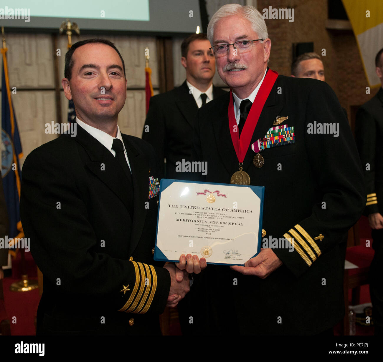 161015-N-MG976-150  JOINT EXPEDITIONARY BASE LITTLE CREEK-FORT STORY, Va. (Oct. 16, 2015)  Cmdr. Carl Koch, command chaplain aboard Nimitz-class aircraft carrier USS Abraham Lincoln (CVN 72), is presented with a Meritorious Service Medal at his retirement ceremony at Joint Expeditionary Base Little Creek, Va., Oct. 16. Lincoln is currently undergoing a Refueling and Complex Overhaul (RCOH) at Newport News Shipbuilding, a division of Huntington Ingalls Industries. (U.S. Navy photo by Mass Communication Specialist 3rd Class Rob Ferrone/Released) Stock Photo