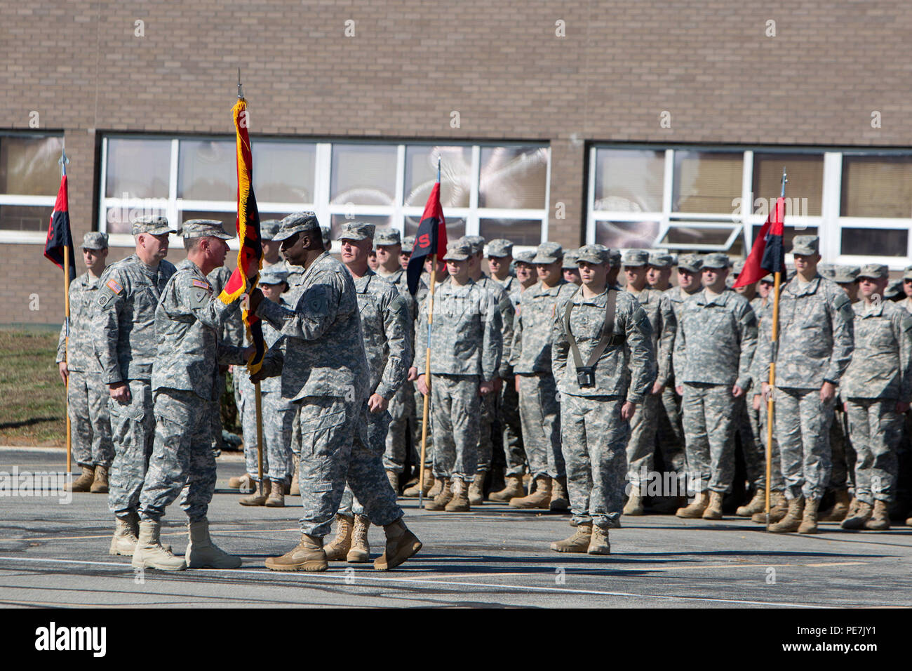 Indiana Army National Guard Lt. Col. Walter Finney passes the colors of the 38th Infantry Division Headquarters and Headquarters Battalion to Maj. Gen. David C. Wood, the 38th ID commanding general, during the battalion’s command change ceremony, Saturday, Oct. 17, 2015. (Photo by Sgt. 1st Class Gary Nelson) Stock Photo
