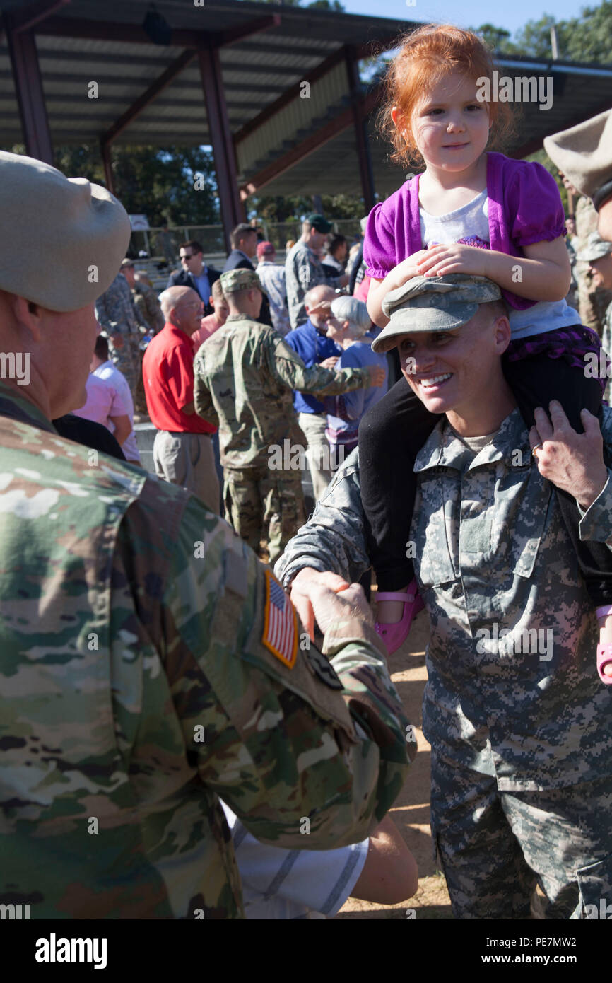 U.S. Army Maj. Lisa Jaster is congratulated while holding her daughter following graduation from Ranger School on Fort Benning, Ga., Oct. 16, 2015. Jaster is the third female to graduate Ranger School. (U.S. Army photo by Spc. Jeffery Harris/ Released) Stock Photo