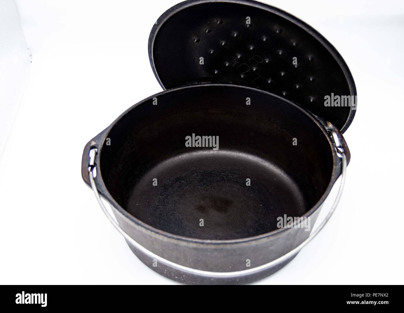 cast iron pot with lid on white background Stock Photo