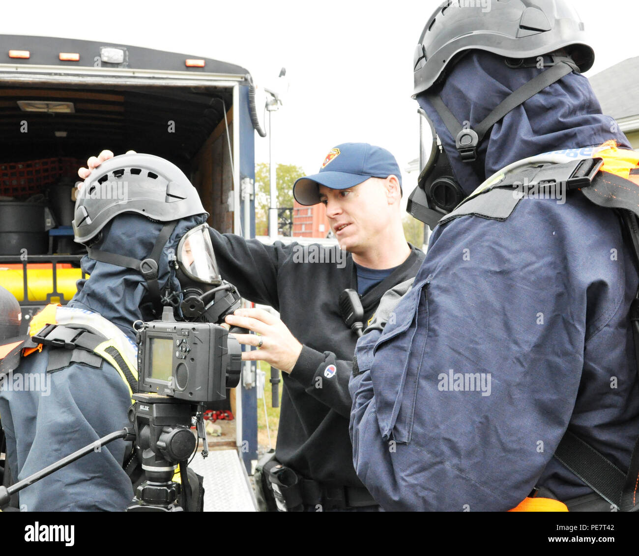 New York Army National Guard Staff Sgt. Anthony Zegarelli checks the personal protective equipment on Air National Guard Staff Sgt. Joshua Spagnola prior to entering a vacant residential building at the Colonie Fire Training Center in Latham, Oct. 20. The members of the 2nd Civil Support Team trained at the center to improve and test their team's ability to rapidly detect and identify chemical, biological, radiological or nuclear (CBRN) hazardous and respond to these threats. (U.S. Army National Guard Photo by Sgt. Maj. Corine Lombardo/ Released) Stock Photo