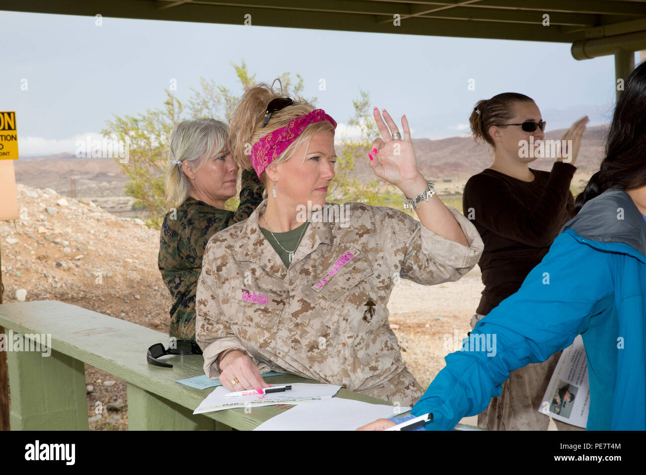 Jennifer Garcia learns how to find her dominant eye prior to firing on