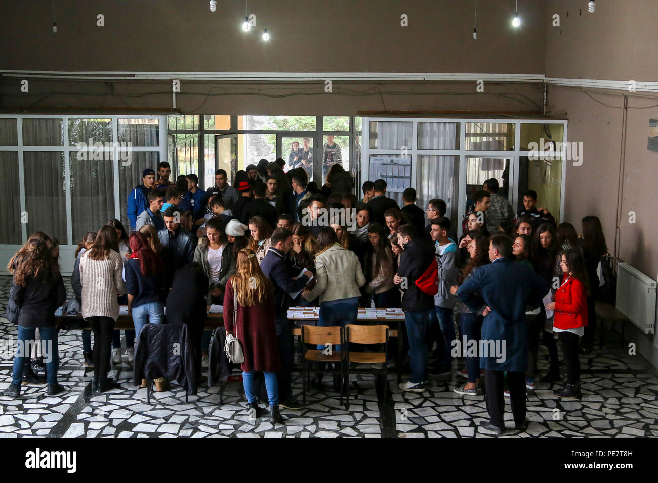Students fill the foyer of a school in Kacanik, Kosovo, waiting to register and sign in for an Oct. 17, 2015, Violence Free Future tolerance event hosted by the Rotary Club out of Pristina, Kosovo. More than 100 students attended the event, which included a question-and-answer panel about discrimination, a speaker who talked about leadership and respect for others within the community, and a session of sports-like games that mimicked life situations dealing with stereotypes. (U.S. Army photo by Staff Sgt. Mary Junell, Multinational Battle Group-East) Stock Photo