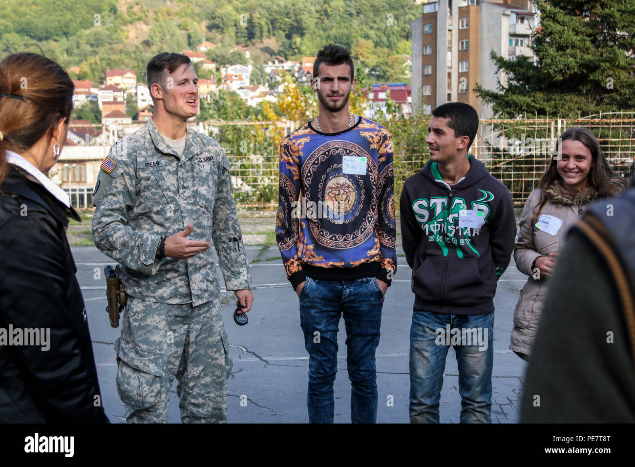 U.S. Army Sgt. Mark Green, a North Carolina National Guard Soldier deployed to Kosovo with A Company, 1st Combined Arms Battalion, 252nd Armor Regiment, leads a discussion on overcoming stereotypes while volunteering at a Violence Free Future youth tolerance event, Oct. 17, 2015, in Kacanik, Kosovo. More than 100 students attended the Pristina Rotary Club-sponsored event, where they participated in discussions and activities geared toward promoting pre-social behaviors around Kosovo’s youth. (U.S. Army photo by Staff Sgt. Mary Junell, Multinational Battle Group-East) Stock Photo