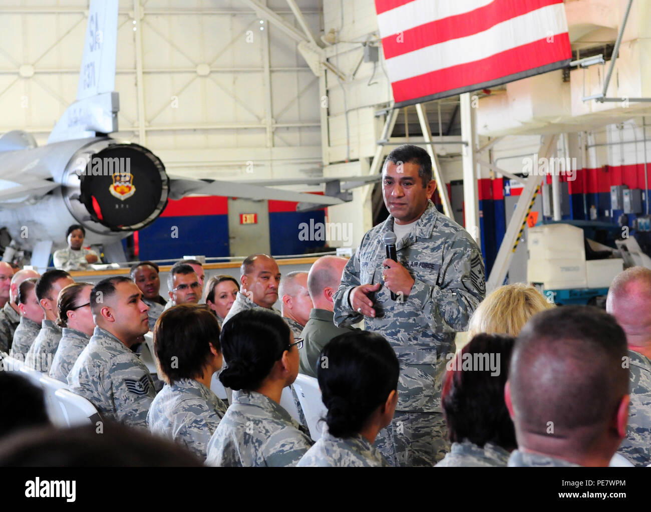 Chief Master Sgt. Gerardo Tapia, command chief for the Air Education and Training Command, speaks to members of the 149th Fighter Wing during an all-call at Joint Base San Antonio-Lackland, Texas, Oct. 21, 2015. Stock Photo