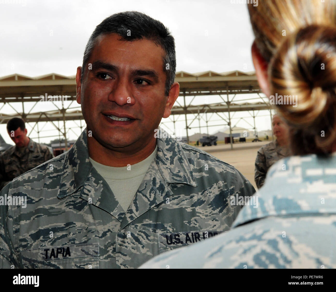 Chief Master Sgt. Gerardo Tapia, command chief for the Air Education and Training Command, talks with members of the 149th Fighter Wing during his visit to Joint Base San Antonio-Lackland, Texas, Oct. 21, 2015. Stock Photo