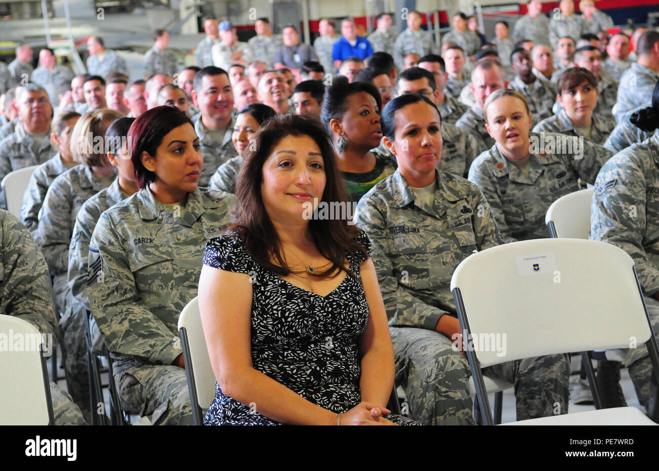 Alice Tapia, wife of the command chief of the Air Education and Training Command, sits with members of the 149th Fighter Wing, waiting for the all-call to start Oct. 21, 2015. She and her husband visited Joint Base San Antonio-Lackland, Texas, with AETC commander Lt. Gen. Darryl Roberson. Stock Photo