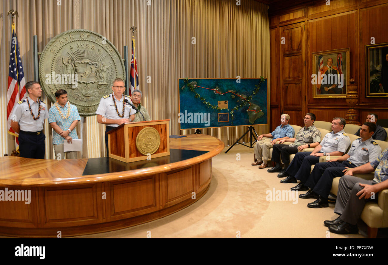 Capt. James Jenkins, Coast Guard 14th District chief of staff, provides remarks after David Ige, Hawaii state governor, read a proclamation announcing the completion of the Anuenue Interisland Digital Microwave Network, at the Hawaii State Capitol in Honolulu, Oct. 22, 2015. Twelve Anuenue “high sites” located on mountaintops in many at remote locations connect with eight sites located at state office buildings and Coast Guard properties. (U.S. Coast Guard photo by Petty Officer 2nd Class Tara Molle/Released) Stock Photo