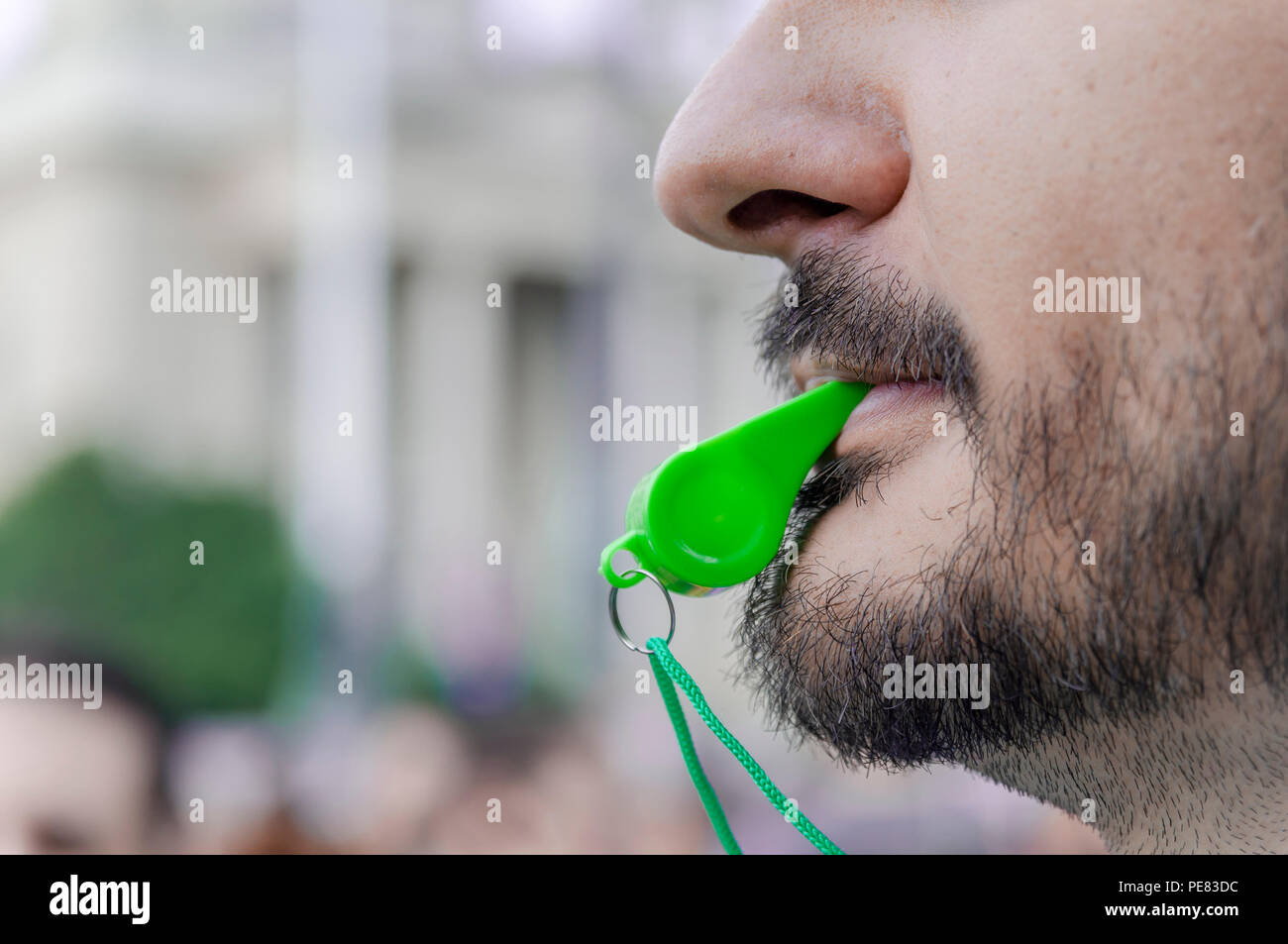 Whistle in mouth hi-res stock photography and images - Alamy