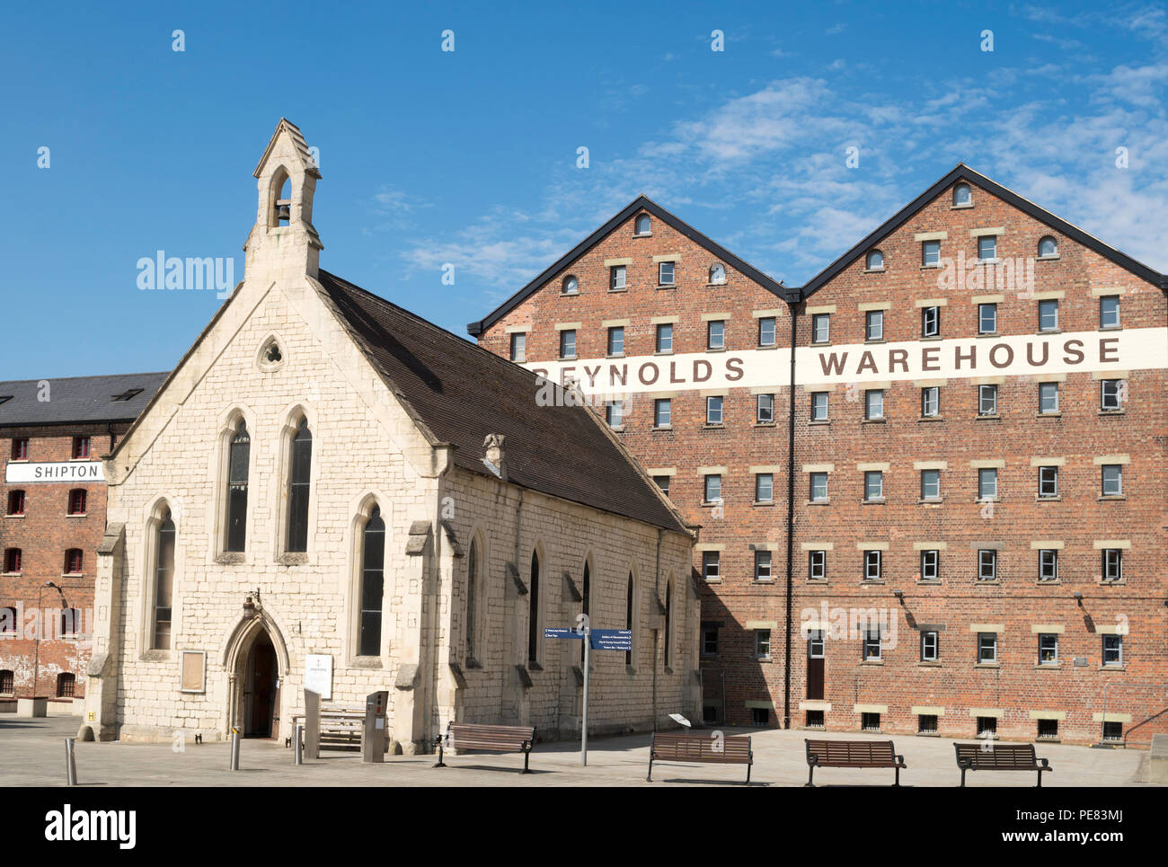Reynolds double warehouse and Mariner's chapel seen from the Victoria basin, Gloucester docks, England, UK Stock Photo
