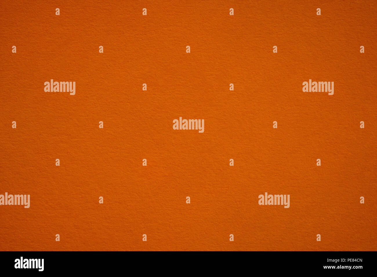 Dark orange paper close up. Large macro background and texture Stock Photo
