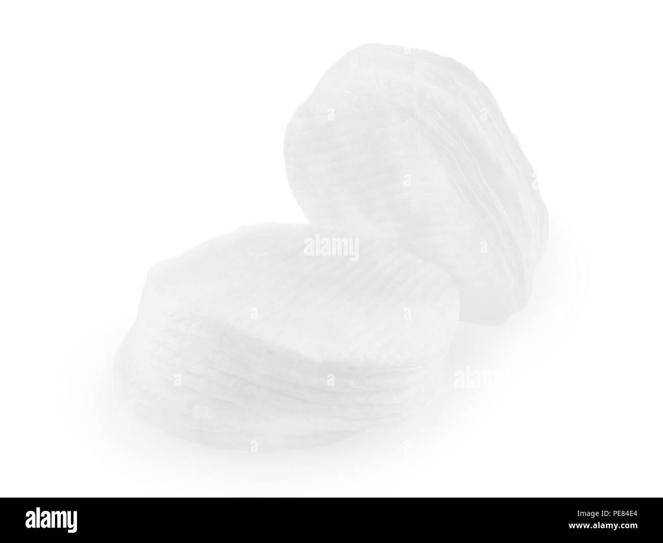 Round white cosmetic cotton pads. Isolated on white Stock Photo