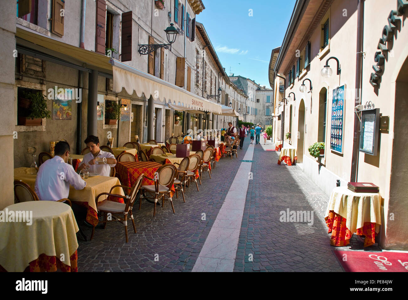 Restaurants at a alley of Bardolino, province Verona, Lake Garda, Lombardy, Italy Stock Photo
