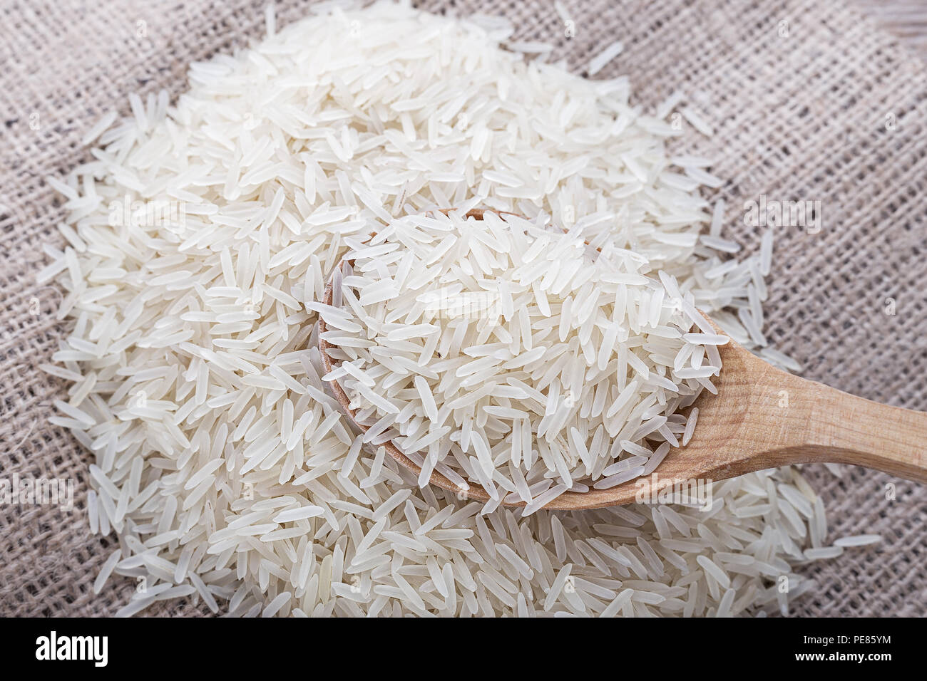 raw rice scattered on the rough surface, top view Stock Photo - Alamy