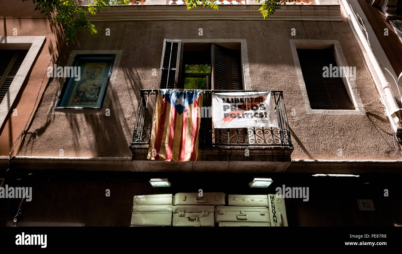 A flag indicating support for Catalan independence hangs from a balcony in Barcelona, Spain Stock Photo