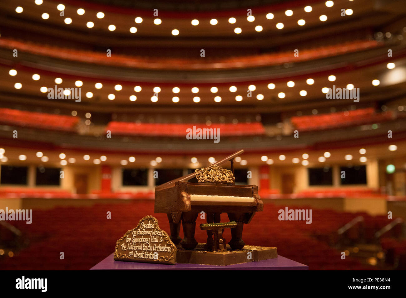 A Cadbury World chocolate grand piano on stage at Birmingham's Symphony Hall, Broad Street, Birmingham. The piano weighing 2kg and made from 44 standard bars of Dairy Milk was a gift to Symphony Hall and the National Youth Orchestra of Great Britain. Stock Photo