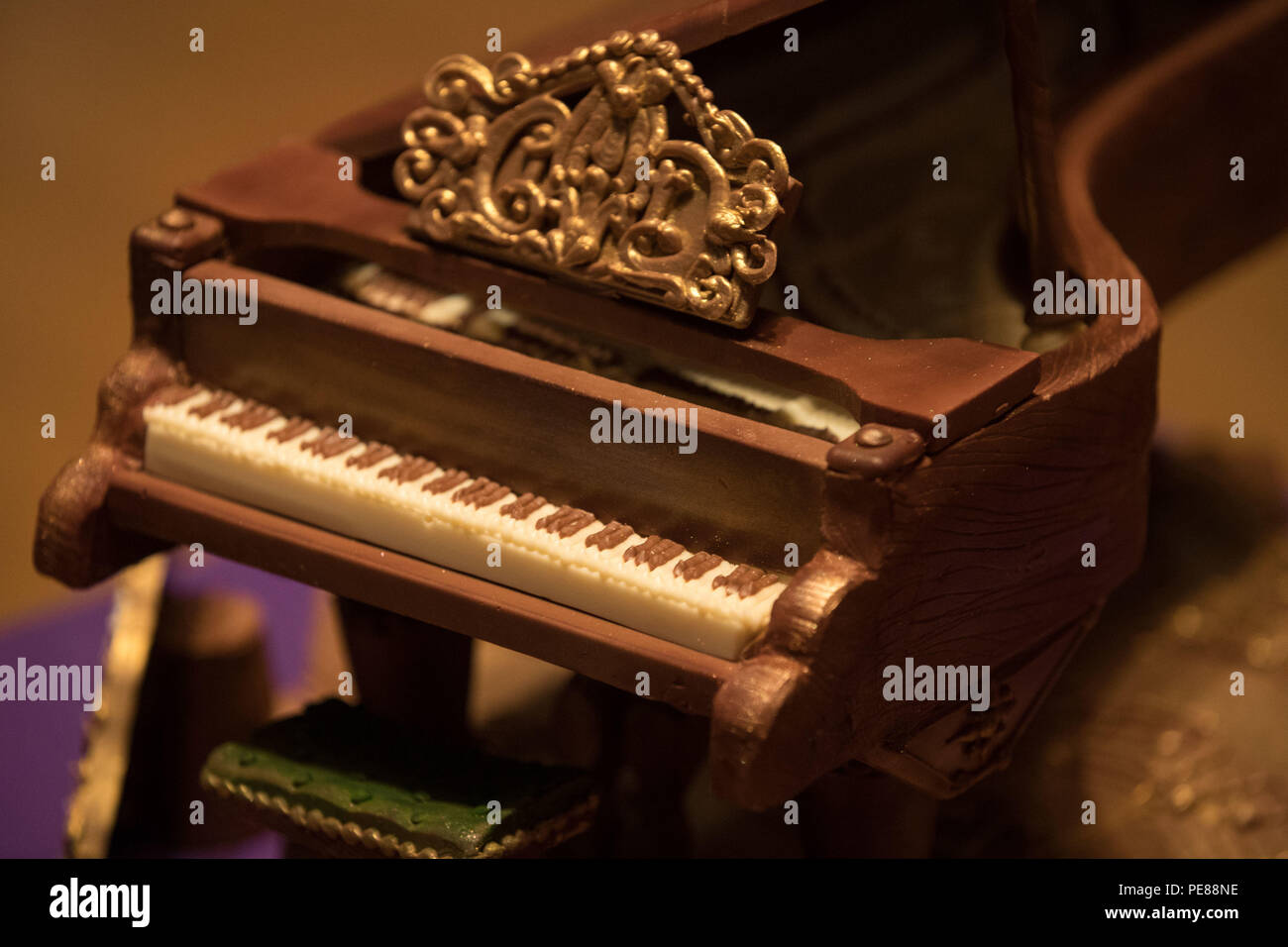 A Cadbury World chocolate grand piano on stage at Birmingham's Symphony  Hall, Broad Street, Birmingham. The piano weighing 2kg and made from 44  standard bars of Dairy Milk was a gift to