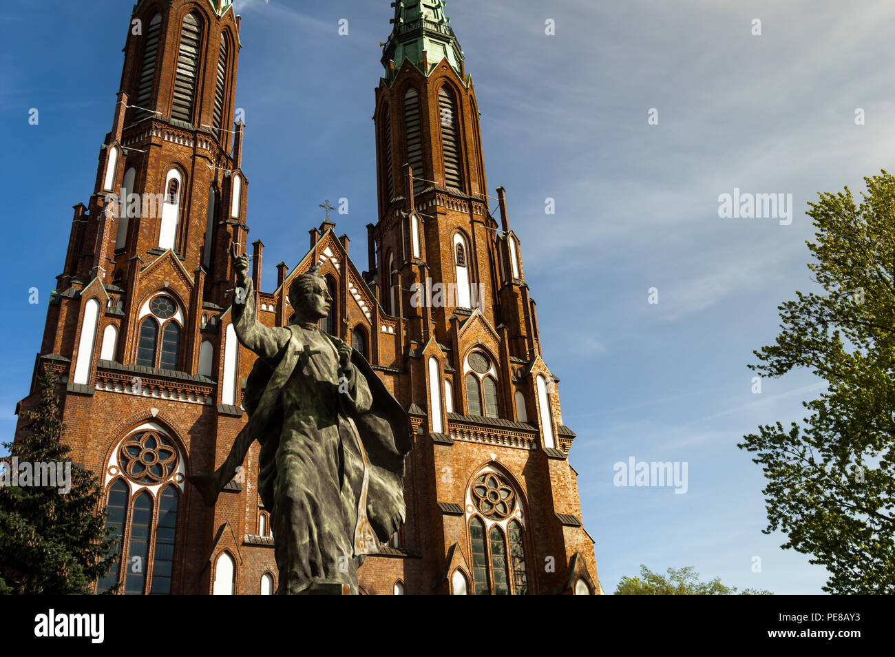 Main facade of Cathedral of St. Michael the Archangel and St. Florian the Martyr in warsaw. Views of the sculpture of the entrance during a clear day. Stock Photo