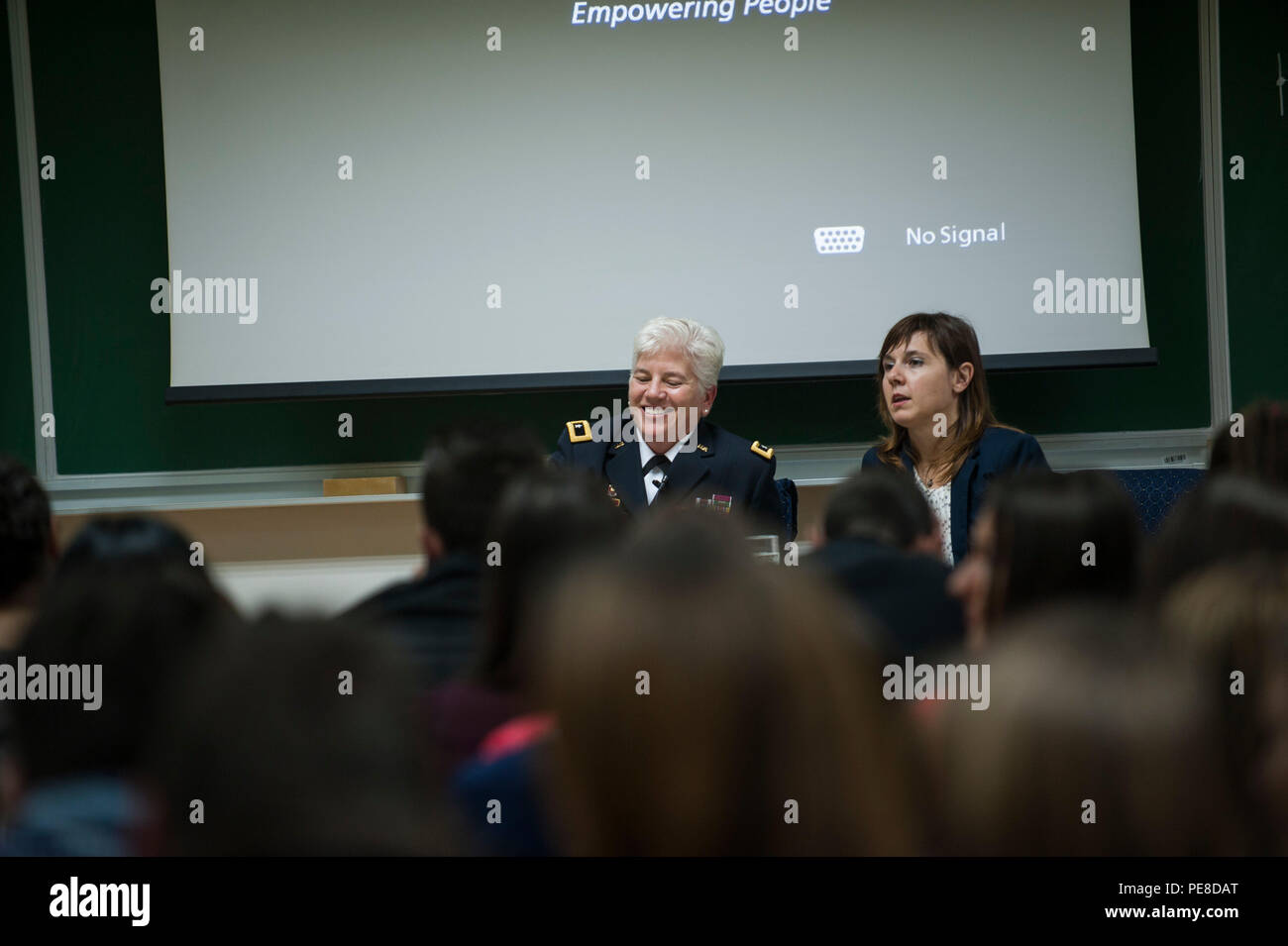 U.S. Army Brig. Gen. Giselle Wilz, NATO Headquarters Sarajevo commander, laughs at a student’s joke while answering questions at the University of Tuzla's Faculty of Law in Tuzla, Bosnia and Herzegovina, Oct. 26, 2015. Wilz spoke about NATO and NHQSa's mission before answering questions from students. (U.S. Air Force photo by Staff Sgt. Clayton Lenhardt/Released) Stock Photo