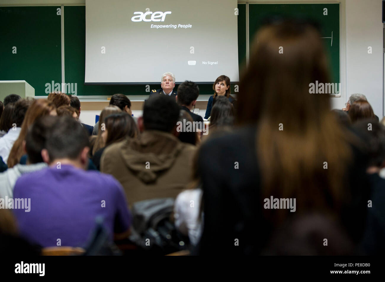 A student asks U.S. Army Brig. Gen. Giselle Wilz, NATO Headquarters Sarajevo commander, a question during her visit to the University of Tuzla's Faculty of Law in Tuzla, Bosnia and Herzegovina, Oct. 26, 2015. Wilz spoke about NATO and NHQSa's mission before answering questions from students. (U.S. Air Force photo by Staff Sgt. Clayton Lenhardt/Released) Stock Photo