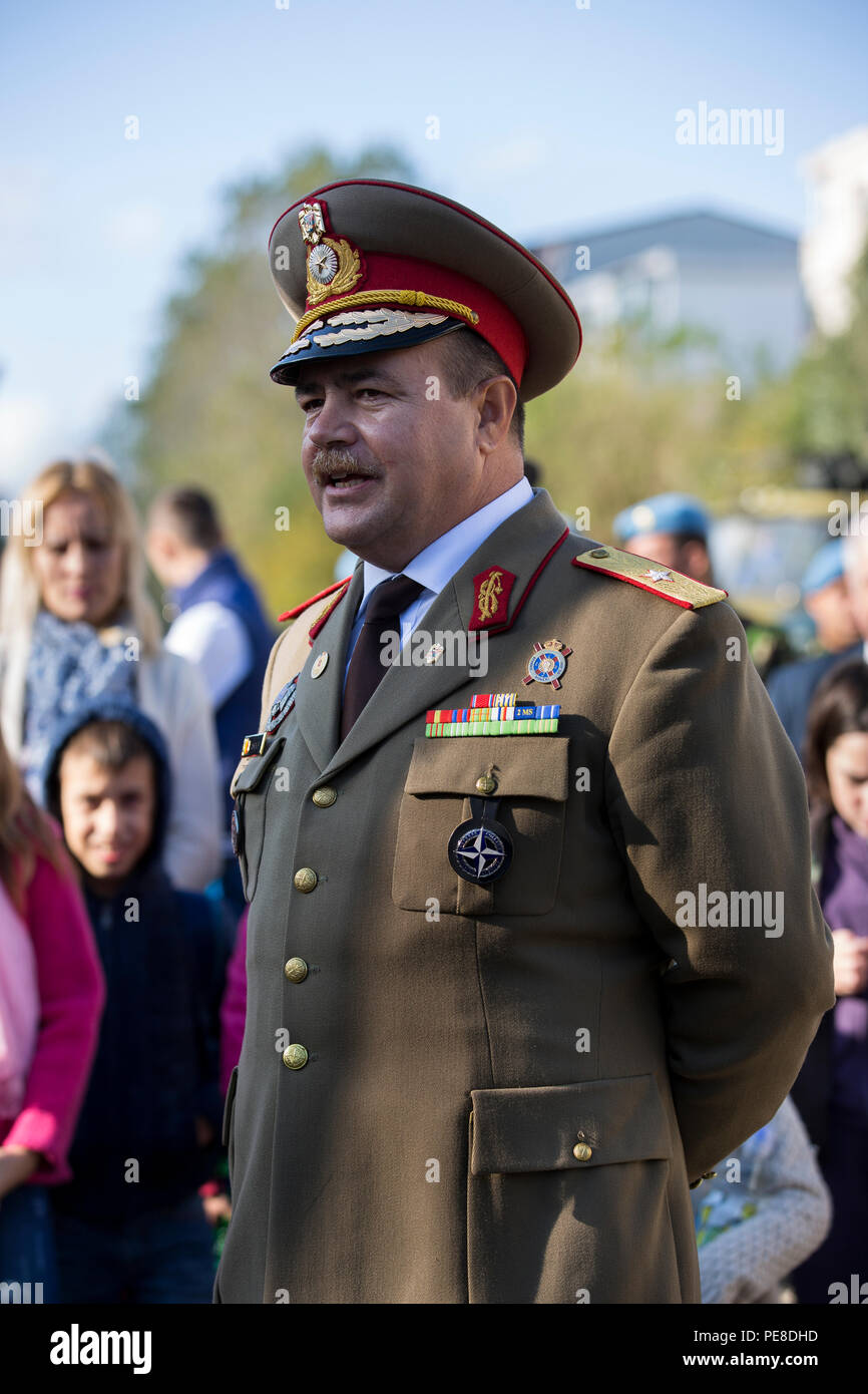 Brigadier Gen. Adrian Soci, with the Romanian 9th Mechanized Brigade, introduces an exhibit during a celebration in Constanta, Romania, Oct. 25, 2015. The event was held to in honor of Romania’s Armed Forces Day and gave U.S. and Romanian military members the opportunity to engage with one another and the local community. (U.S. Marine Corps photo by Lance Cpl. Melanye E. Martinez/Released) Stock Photo