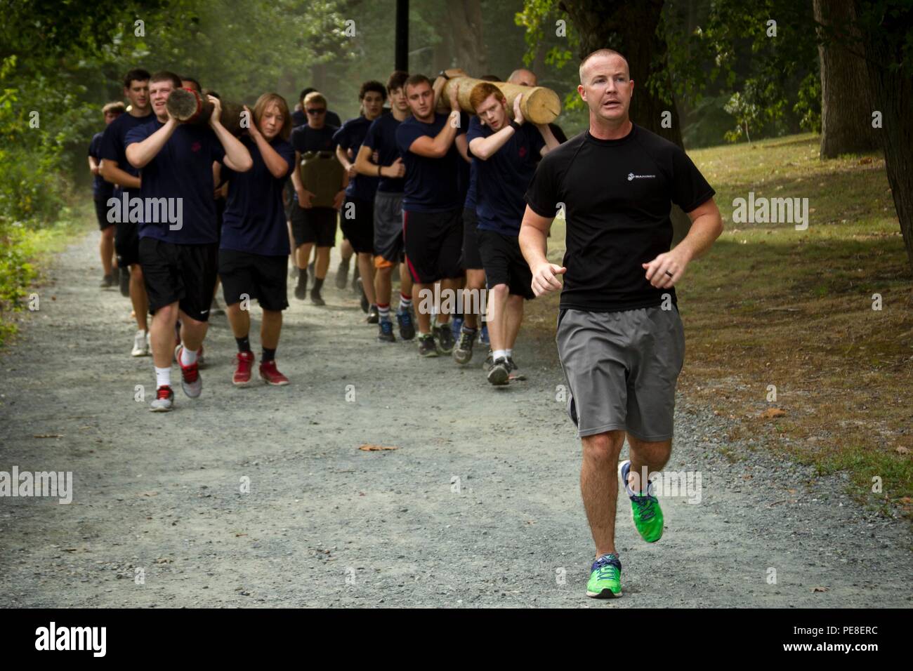 U.S. Marine Corps Sgt. Randall Dobbs, a recruiter for Recruiting Station Baltimore and a native of Macon, Ga., leads members of the Marine Corps’ Delayed Entry Program on a three-mile logistics hike at the Salisbury Zoo in Salisbury, Md., Sept.  12, 2015. Approximately 30 Marine Corps recruits, also known as poolees, participated in the hike, which was designed to physically challenge them and build camaraderie prior to attending recruit training at Marine Corps Recruit Depot Parris Island, South Carolina later this year. (U.S. Marine Corps photo by Sgt. Bryan Nygaard/Released) Stock Photo