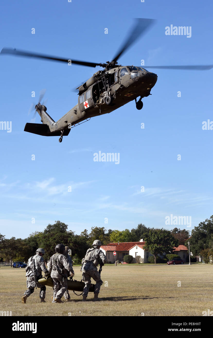 A medical evacuation demonstration team transports a patient on a ...
